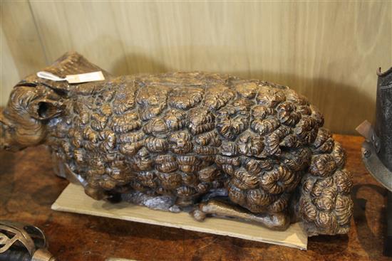 A 16th century Flemish oak deep relief figure of the recumbent lamb W.29in.